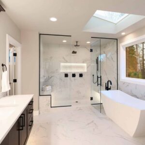 Luxury modern home bathroom interior with dark brown cabinets, white marble, walk in shower, free standing tub, two mirrors, flowers.