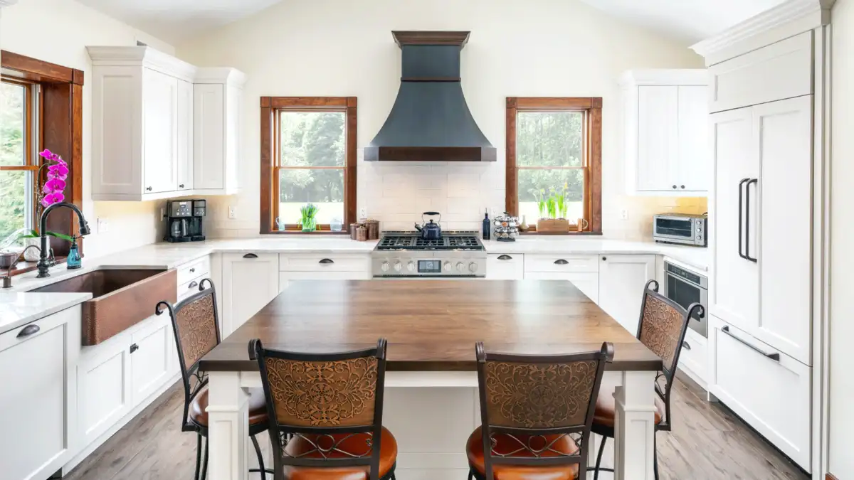 white kitchen cabinets with brown table